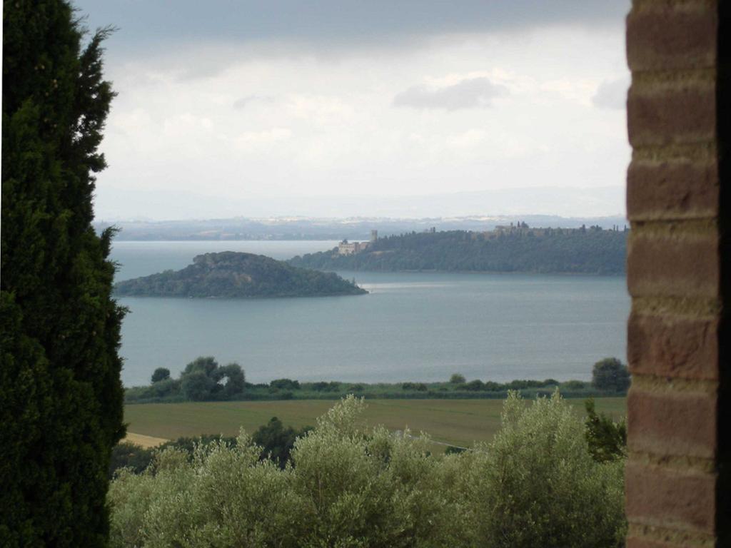 الشقق الفندقية باسّينيانو سول تْرازيفي  Antico Casale Tiravento الغرفة الصورة